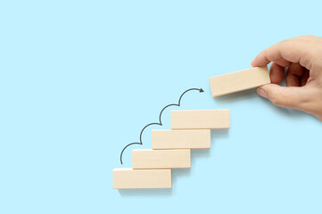 Ladder career path for business growth success process concept. Hand arranging wood block stacking...