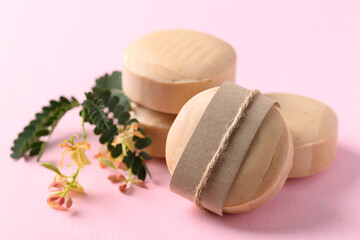 Tamarind soap on pink background, organic natural product for skin care