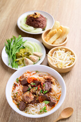 Northern Thai food (Kanom Jeen Nam Ngeaw), Rice noodles spicy soup with pork and pork blood eating with fresh vegetables and pork rind