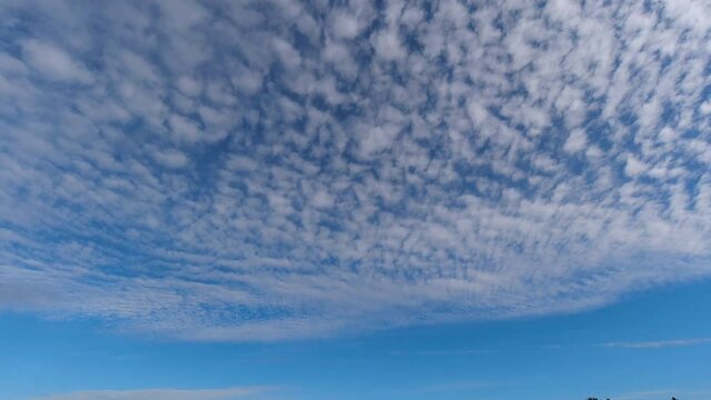 Time lapse of blue sky with cirrocumulus clouds.