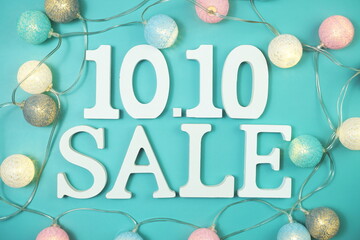 10.10 Sale alphabet letter with LED cotton balls on blue background