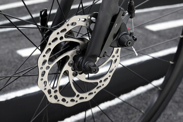 bicycle parts disc brake bike front wheel in close up.