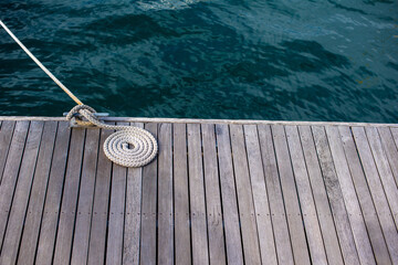 Close up shot of rope of boat attached to dockin station