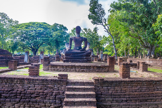 Landmark of Buddha image made of ancient bricks in the Kamphaeng Phet Historical Park, Thailand.