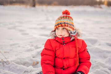 Little boy having fun in the snow