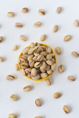 pistachios , many heap of pista dry fruits and nuts in background layout , Kerala India. nuts pattern background , layout of seeds, Protein fiber rich food diet muscle body building