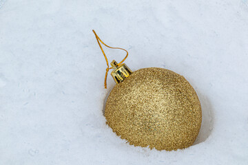 beautiful Christmas fur-tree toys in the snow with the structure in the Christmas and New year