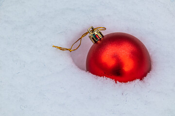 beautiful Christmas fur-tree toys in the snow with the structure in the Christmas and New year