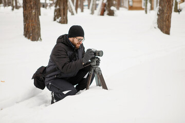 Video filming in snowy park.