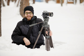 Video filming in snowy park.