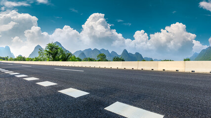Country asphalt road and green mountain natural scenery in Guilin,China.
