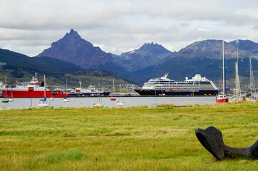 Modern cruise ship, cruiseship liner or expedition vessel ship in port of Ushuaia, Argentina with...