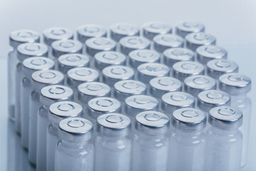 Glass medical ampoule vial for injection. Medicine is dry white drug penicillin powder or liquid...