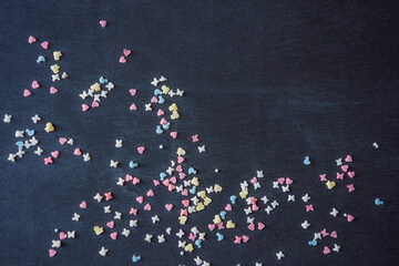 Colorful sweet background with colorful sprinkles. Holiday treat. Cupcake and Ice cream topping. Sweet Texture. Sweet Background