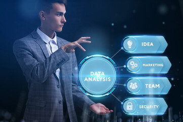 Business, Technology, Internet and network concept. Young businessman working on a virtual screen of the future and sees the inscription: Data analysis