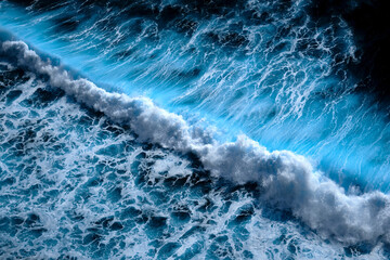 Fototapeta na wymiar Aerial view to waves in ocean Splashing Waves. Blue clean wavy sea water