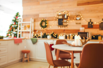 Fototapeta na wymiar Interior of modern kitchen decorated for Christmas, blurred view