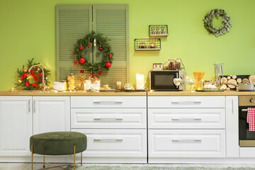 Fototapeta premium Interior of modern kitchen decorated for Christmas