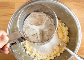 Sift flour dough bowl, top view into metal tool