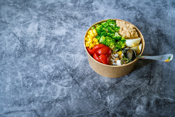 Healthy Organic Athlete Protein Food Bowl with Broccoli, Tricolor Quinoa, Peanut Butter Soy Sauce, Brown Rice, Egg and Hummus for Fitness Sport.