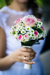 a beautiful bouquet of a bride for her wedding with colorful flowers and a ratheri