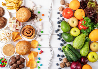 Fruit and vegetables vs sweets and fast food top view flat lay