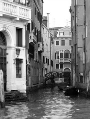 Venice, Italy, December 28, 2018 evocative image of the foreshortening of a canal with a bridge connecting houses