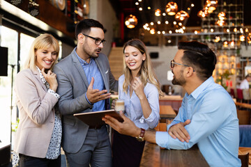 Business people having fun and chatting at workplace office