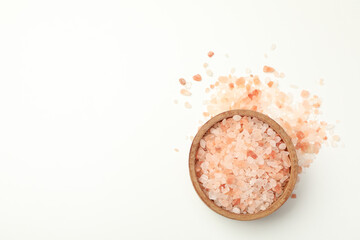 Bowl of pink himalayan salt on white background