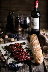 The cut salami sausage on a chopping board