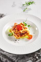 Lasagna with tomato and green leaf