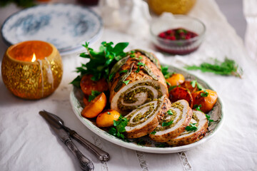 Turkey porchetta with caramelised clementines on the Christmas background .style rustic.