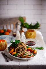 Turkey porchetta with caramelised clementines on the Christmas background .style rustic.
