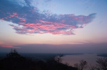 Beautiful pink clouds on a sunset above the Mekong River near Pakse, Laos