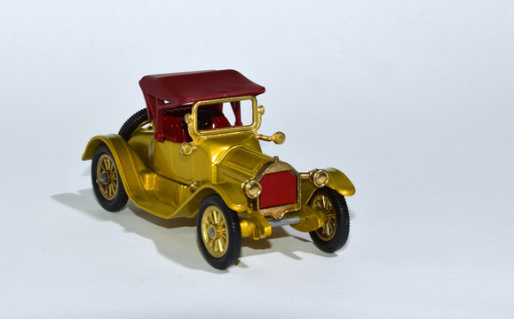 Toy diecast model car 1913  Cadillac a Matchbox yesteryear product by Lesney with white background.