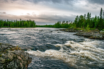 Stormy rapids river against a stormy sky