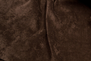 Velour fabric brown background texture. 
Textile brown top view