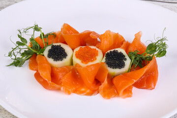 Sliced salmon with caviar