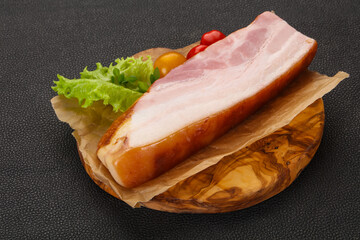 Smoked pork breast with salad leaves