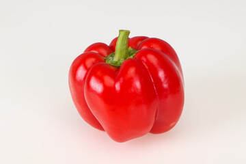 Ripe red bell pepper isolated on white