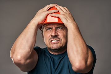 Stressed engineer in hardhat