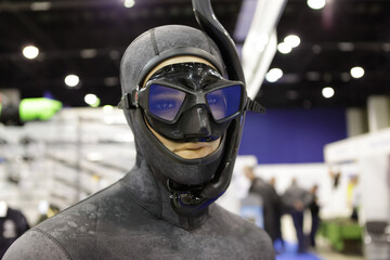 Mannequin diver in a suit with a mask and snorkel