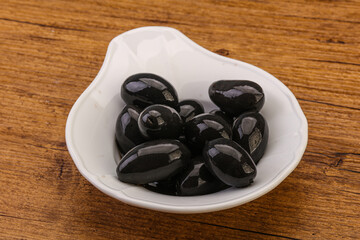 Pickled black olives in the bowl
