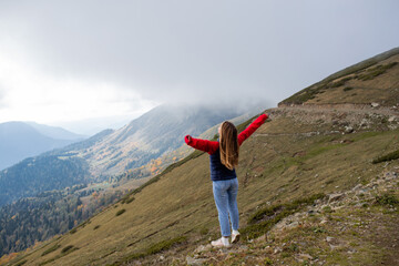 Obraz premium Young woman on a mountain hike in Sochi, Russia.