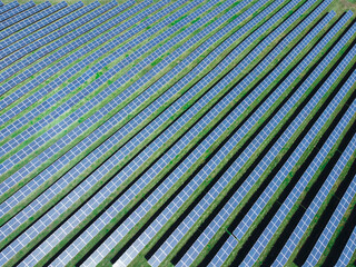 Aerial view of solar power plant. Renewable energy theme. Solar panels from above. The concept of...