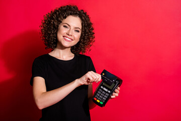 Photo of pretty sweet wavy lady dressed casual black outfit paying terminal wireless credit card...