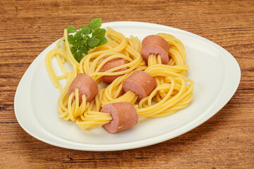 Kids pasta spaghetti with sausages