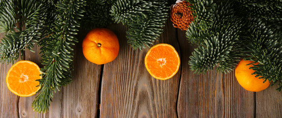 christmas background. christmas tree and tangerin or mandarin on wooden table. concept of new year top view