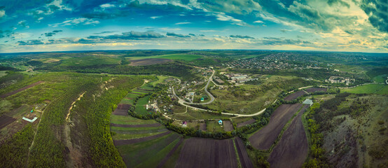 Little moldavian village Goeni in green lands, aerial view, summer time, Moldova republic of.