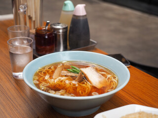Japanese soba noodles in a hot soup with pork and green onion